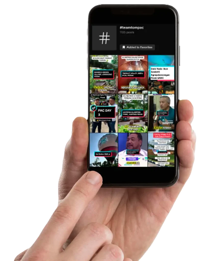 Hand holding a smartphone displaying a grid of various video thumbnails with different thumbnails and colorful text overlays. CK Media