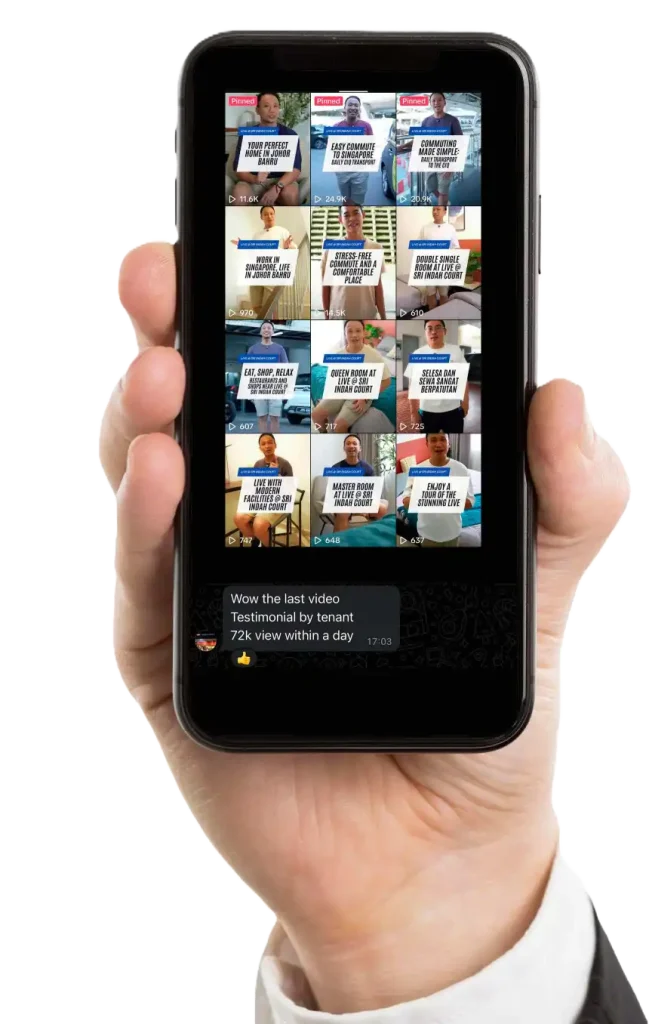 A hand holds a smartphone showing a social media app with a grid of video thumbnails, each depicting someone with a sign. This highlights the intuitive video content management system that seamlessly organizes and showcases user-generated stories. CK Media