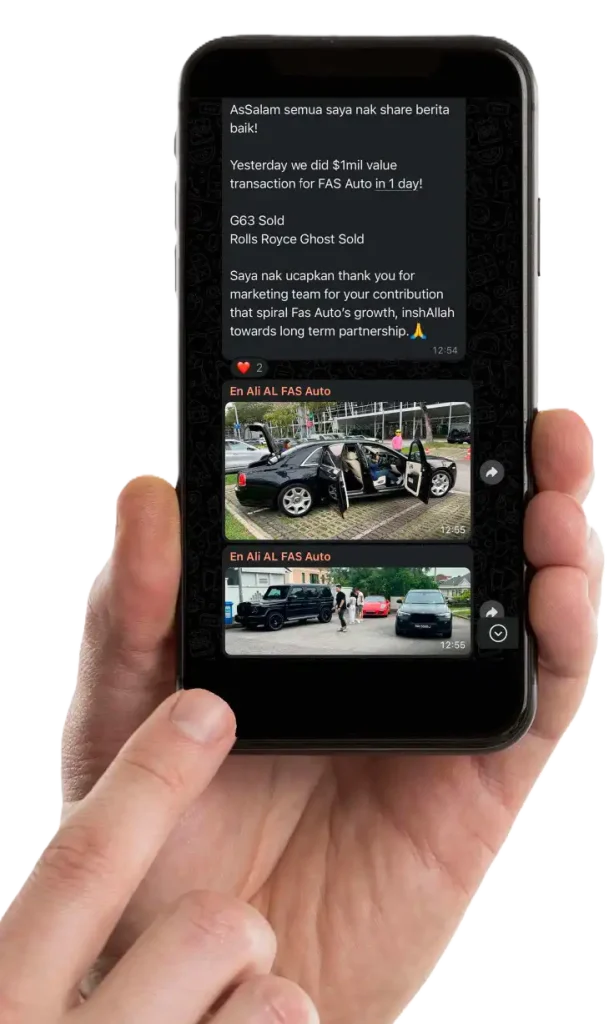 A hand holding a smartphone displays a messaging app featuring video content about car sales and images of people near parked vehicles. CK Media