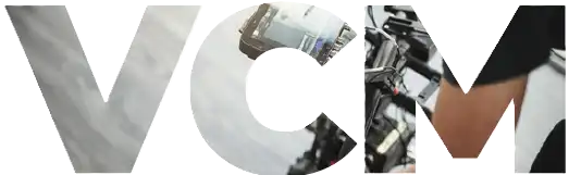 The image displays the letters VCM in bold, accompanied by a partial view of a persons arm holding a microphone, highlighting the services they offer. CK Media