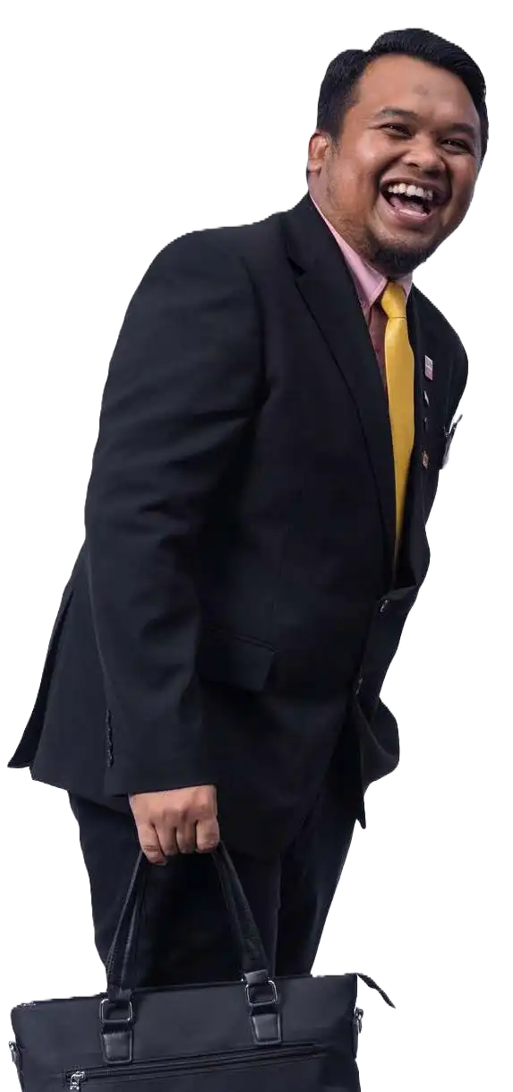 A person in a black suit and yellow tie is smiling broadly, holding a black bag in one hand. CK Media